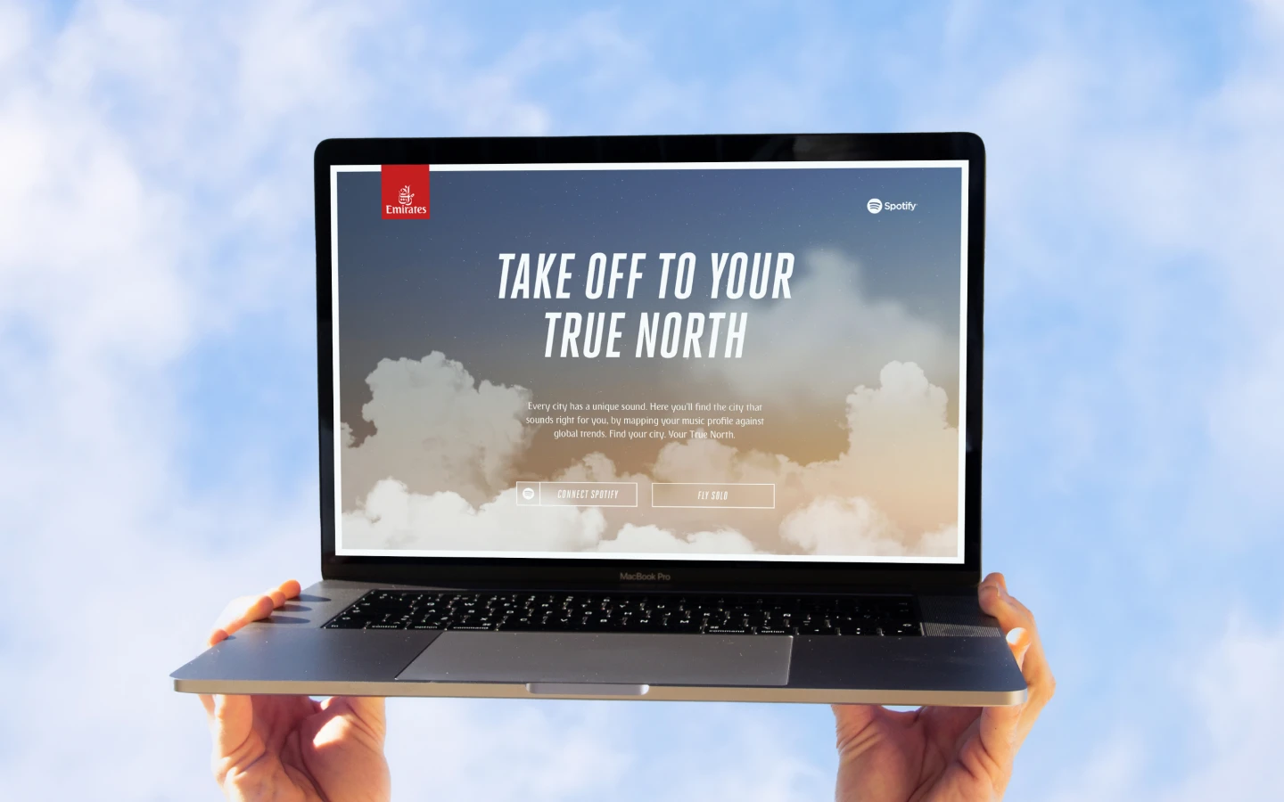 A laptop showing the Emirates Truth North website landing page.
